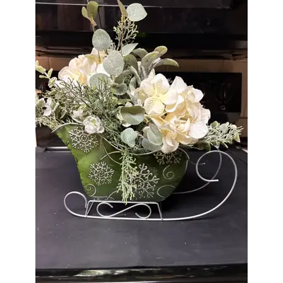Green sleigh with white hydrangeas