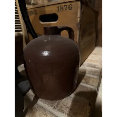 Brown Jug chip in bottom