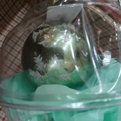 Vintage 3.5 inch light green santa in sleigh ornament